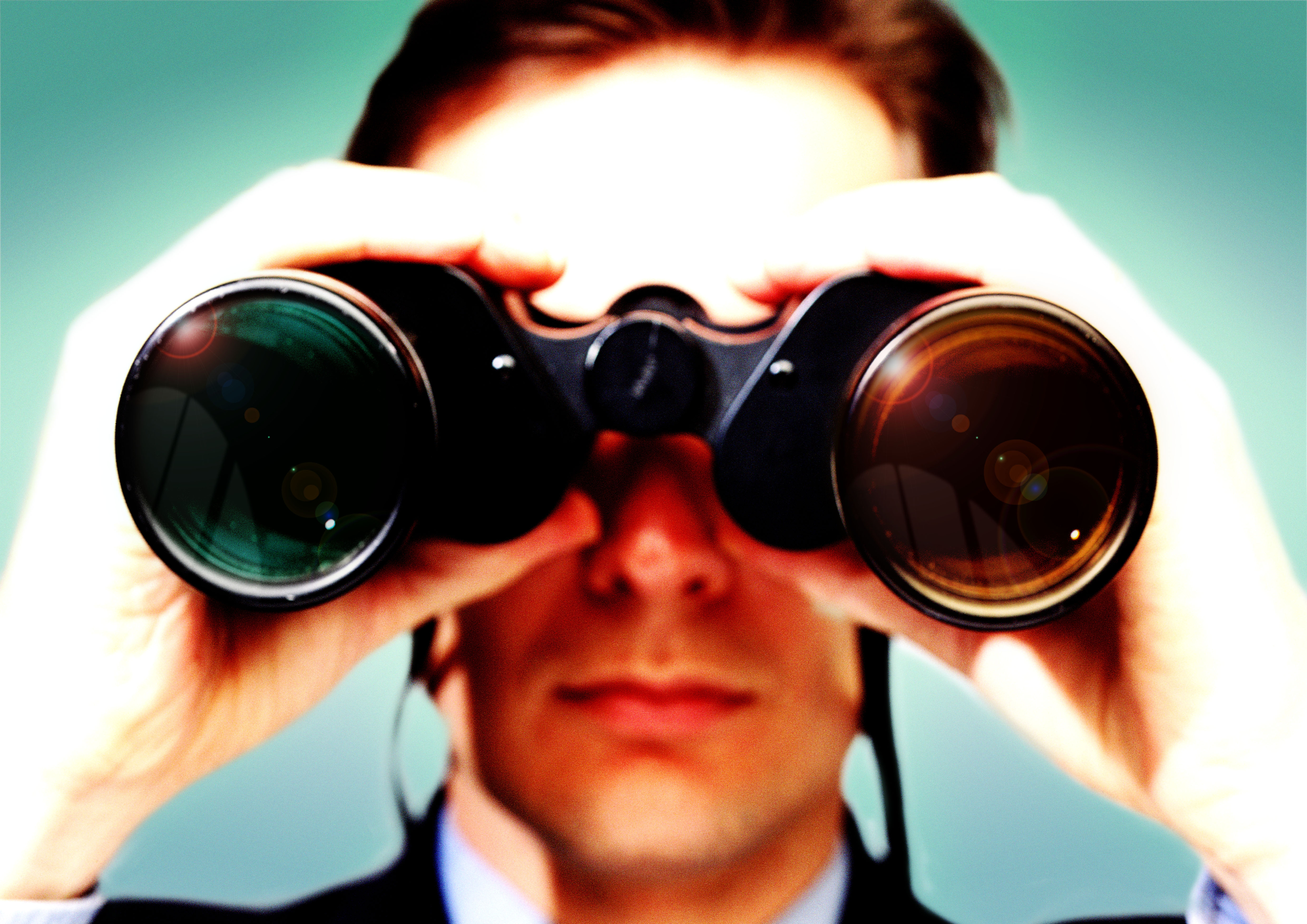 2000 --- Businessman Using Binoculars --- Image by © Royalty-Free/Corbis